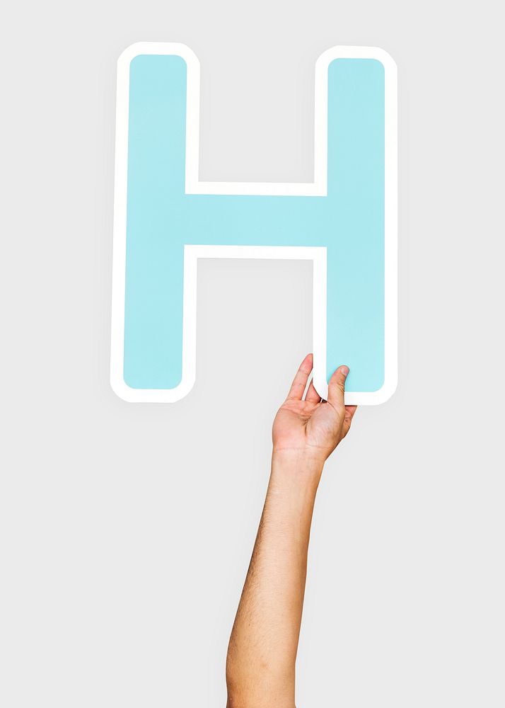 Hands holding the letter H