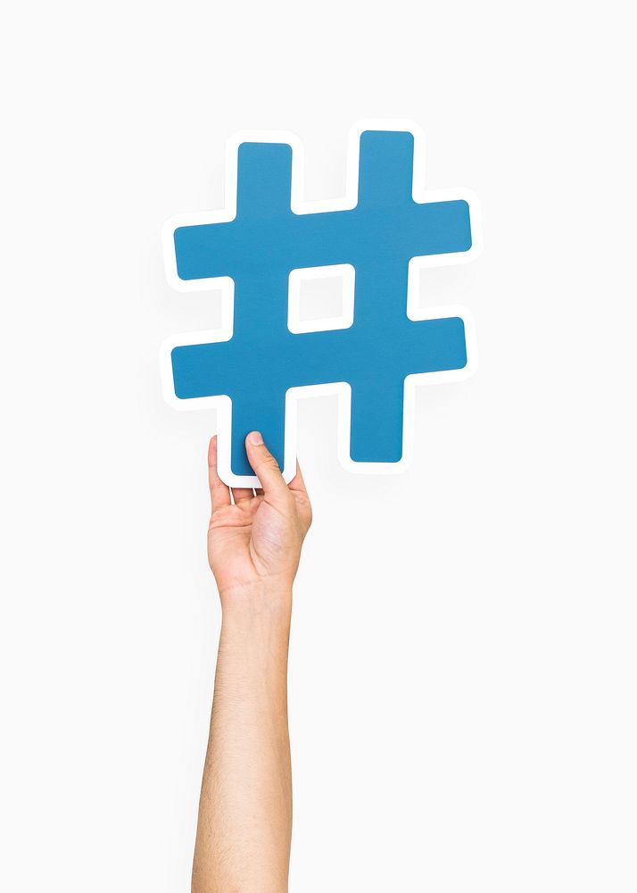 Hand holding hashtag symbol