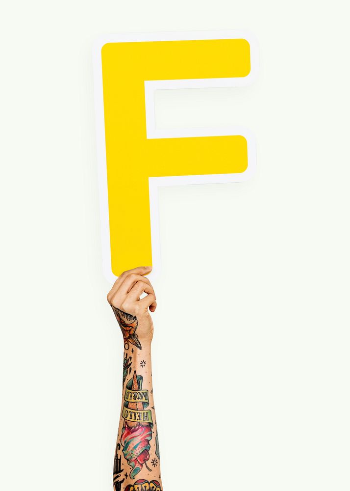 Hand holding the letter F