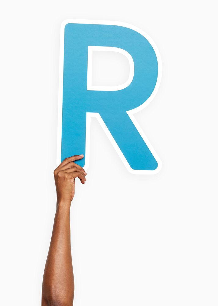 Hand holding the letter R