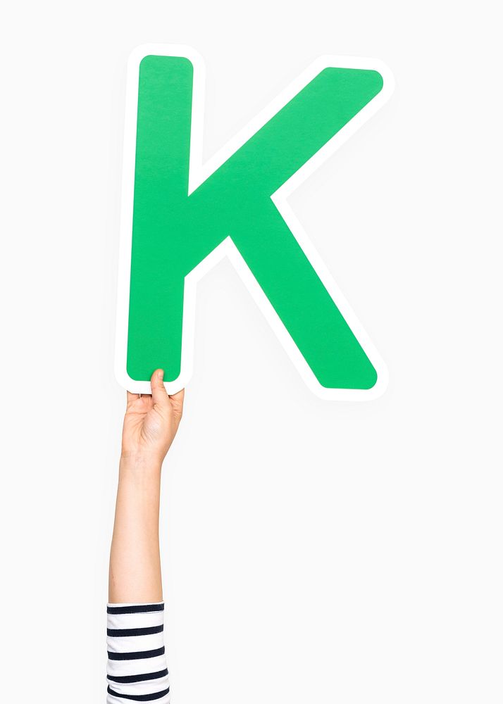 Hand holding the letter K