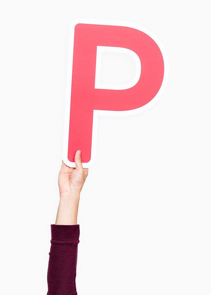Hand holding the letter P