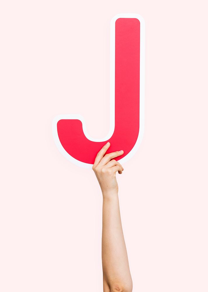 Hands holding the letter J