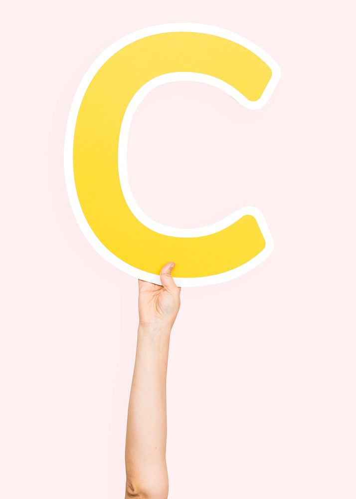 Hands holding the letter C