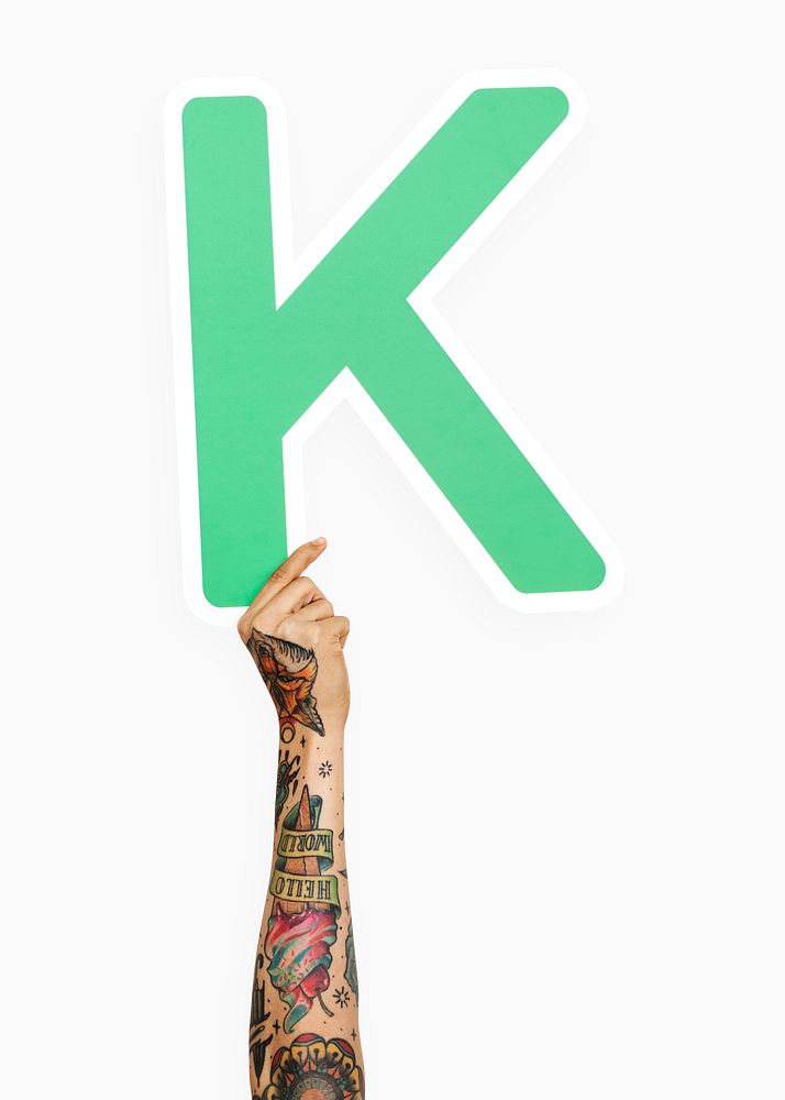 Hand holding the letter K