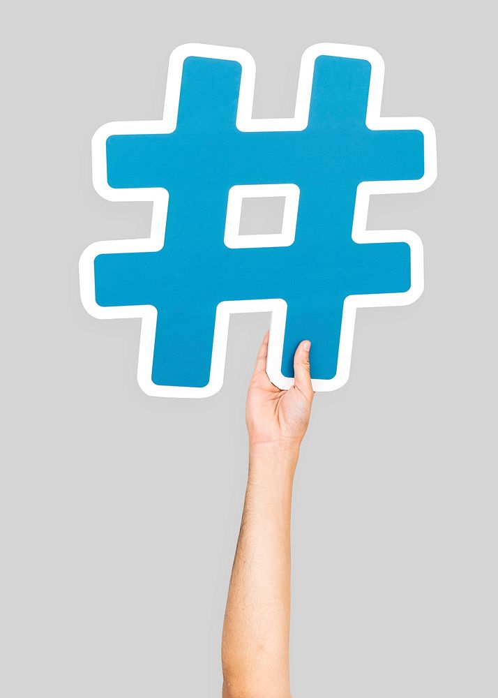 Hand holding hashtag symbol