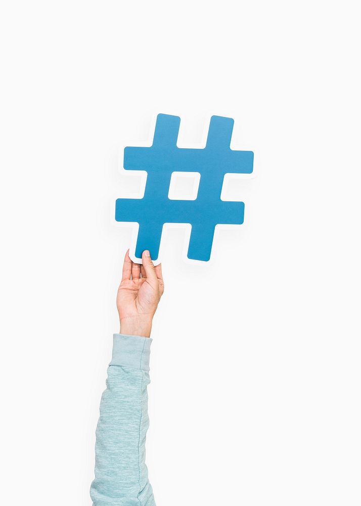 Hand raised holding hashtag icon