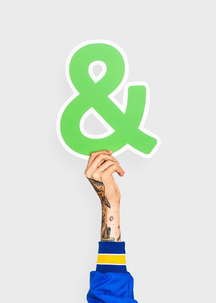 Hand holding an ampersand sign