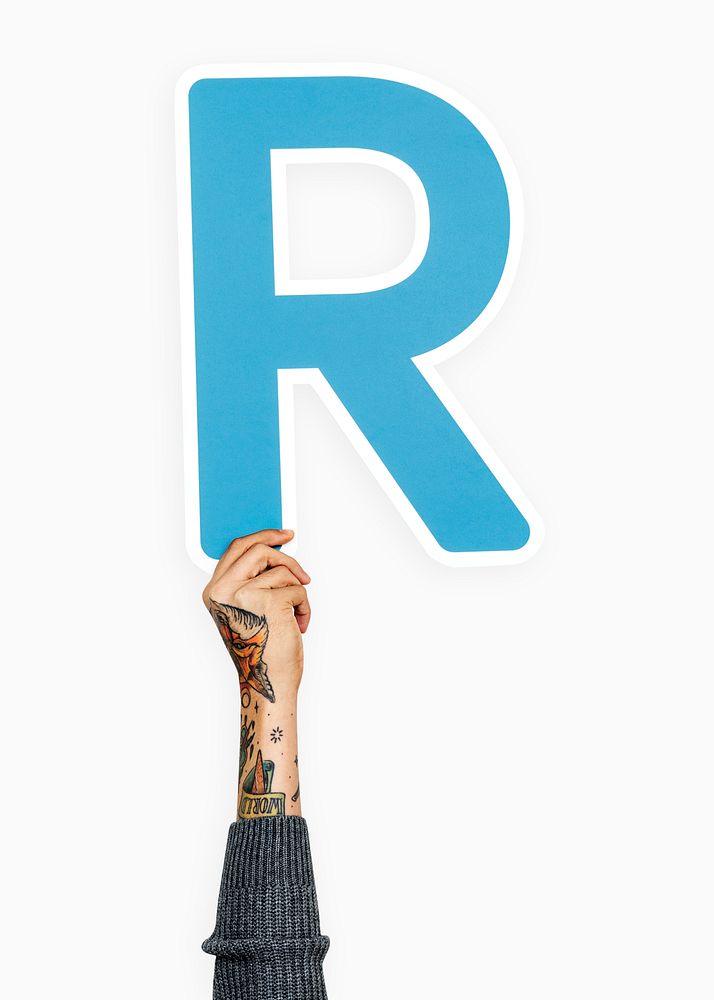 Hand holding letter R sign