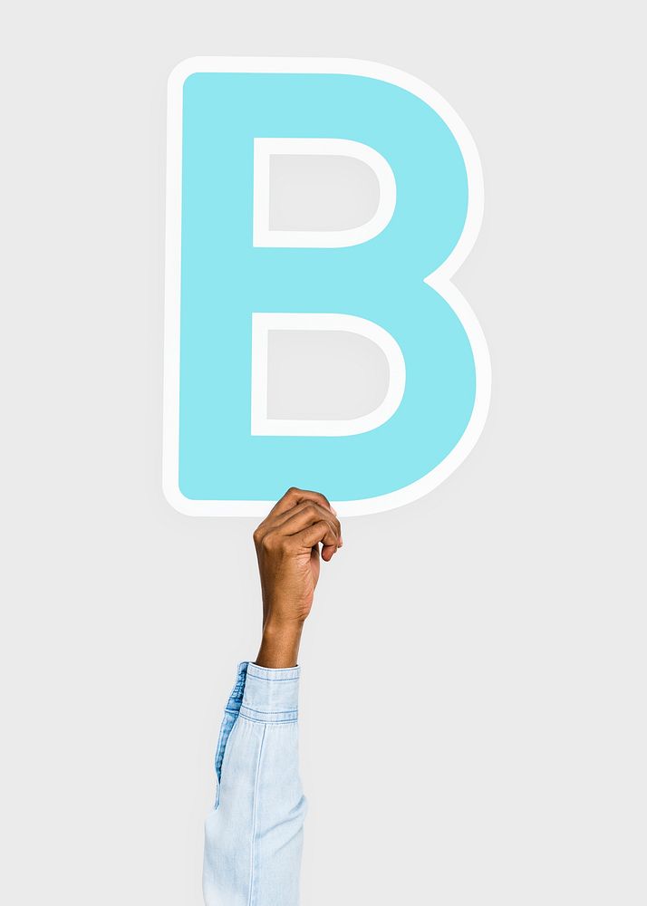 Hand holding B sign, isolated on light grey