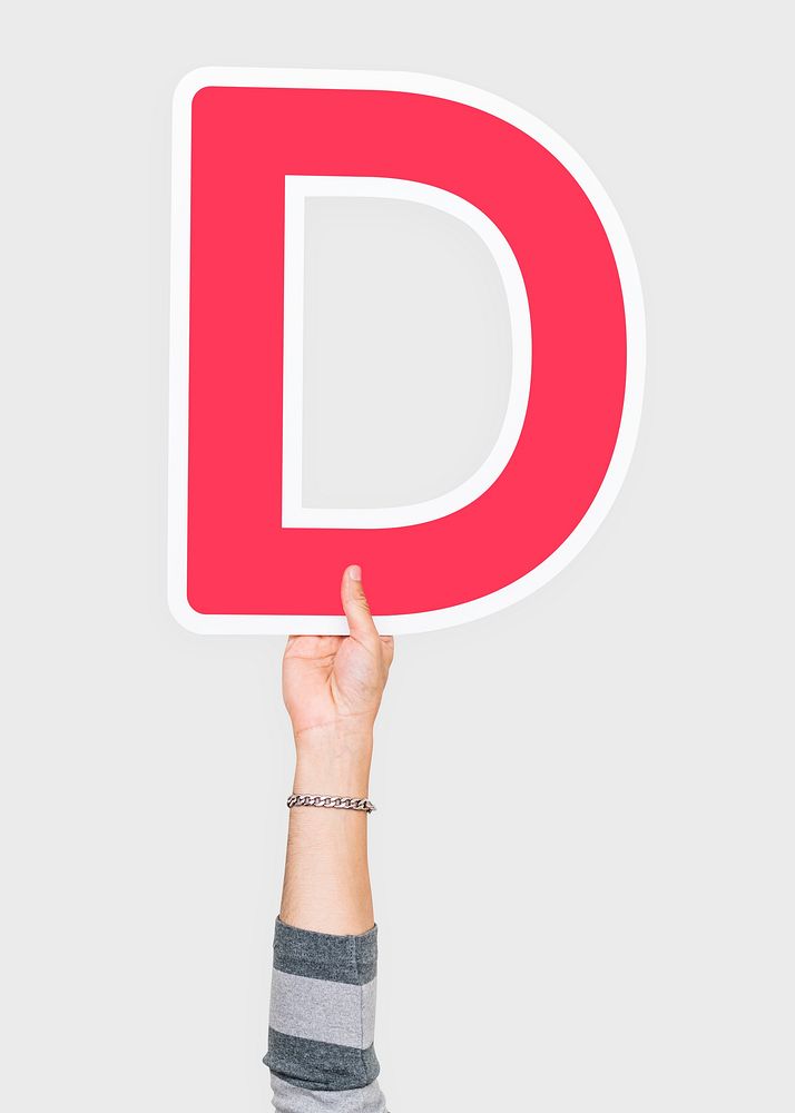 Hand holding D sign, isolated on light grey