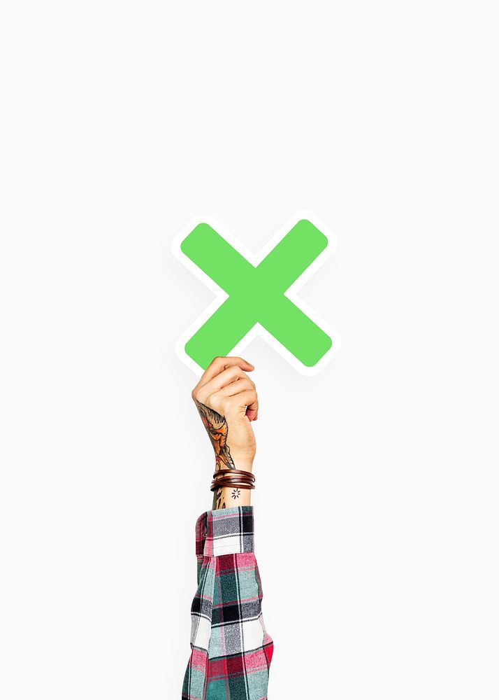 Hand holding letter X sign