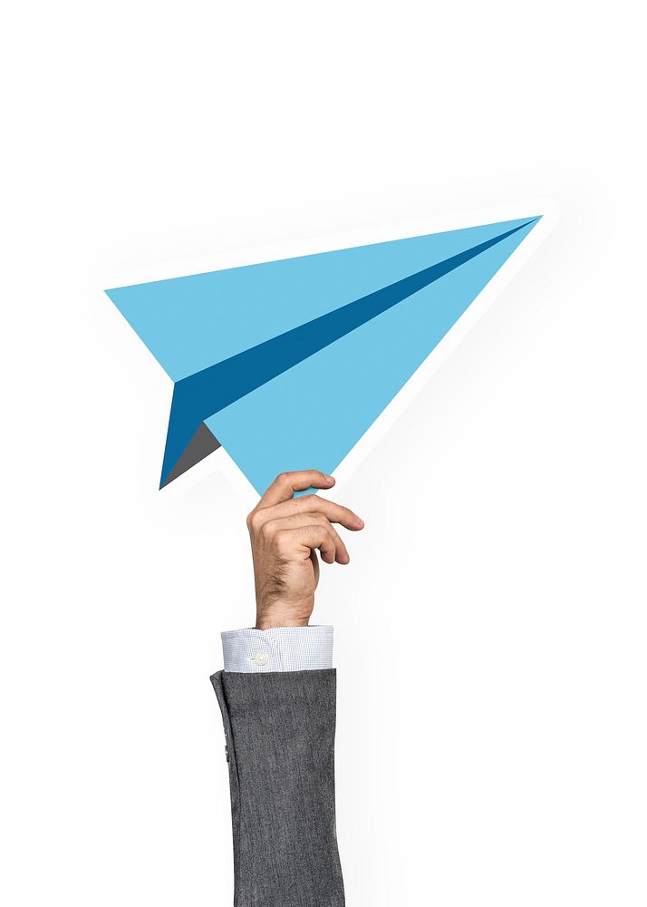 Hand holding a paper plane clipart