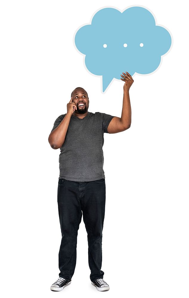 Man holding a speech bubble and talking on a phone