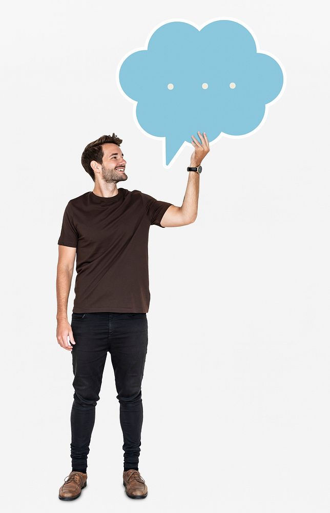 Cheerful man holding a blank speech bubble symbol