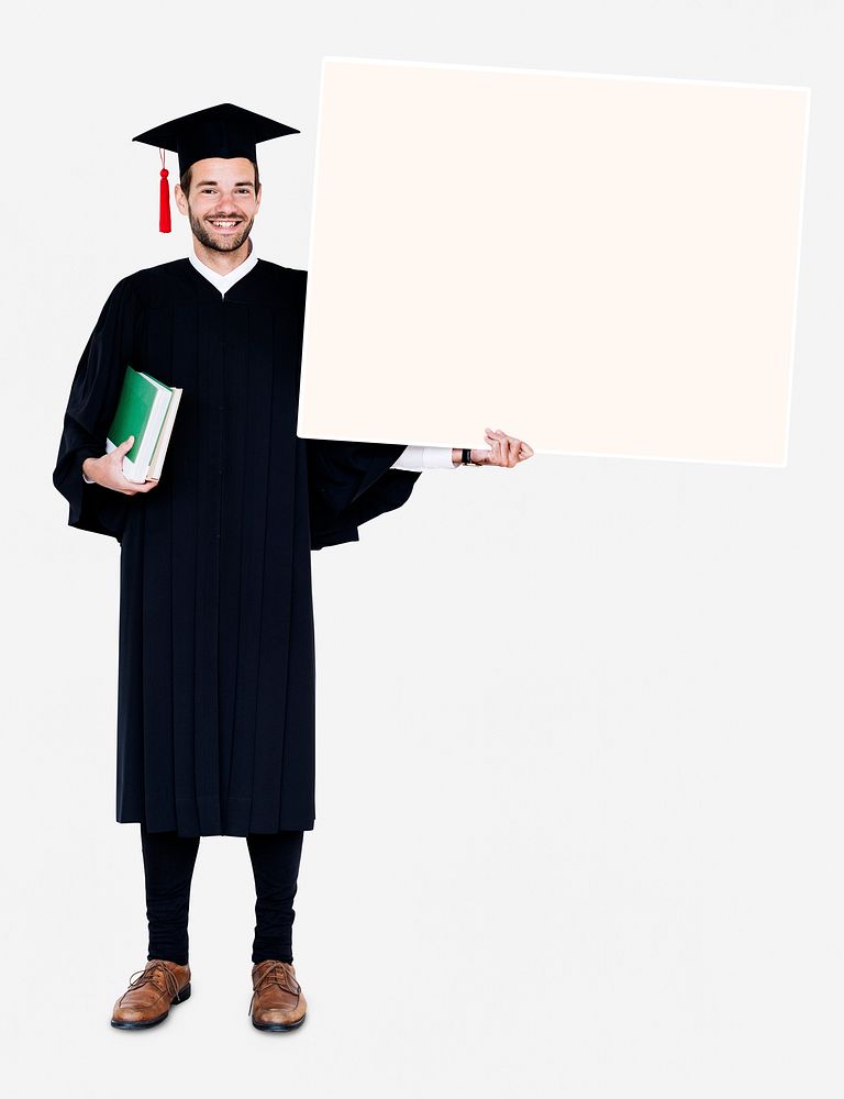 Man in a graduation clothing holding a copy space