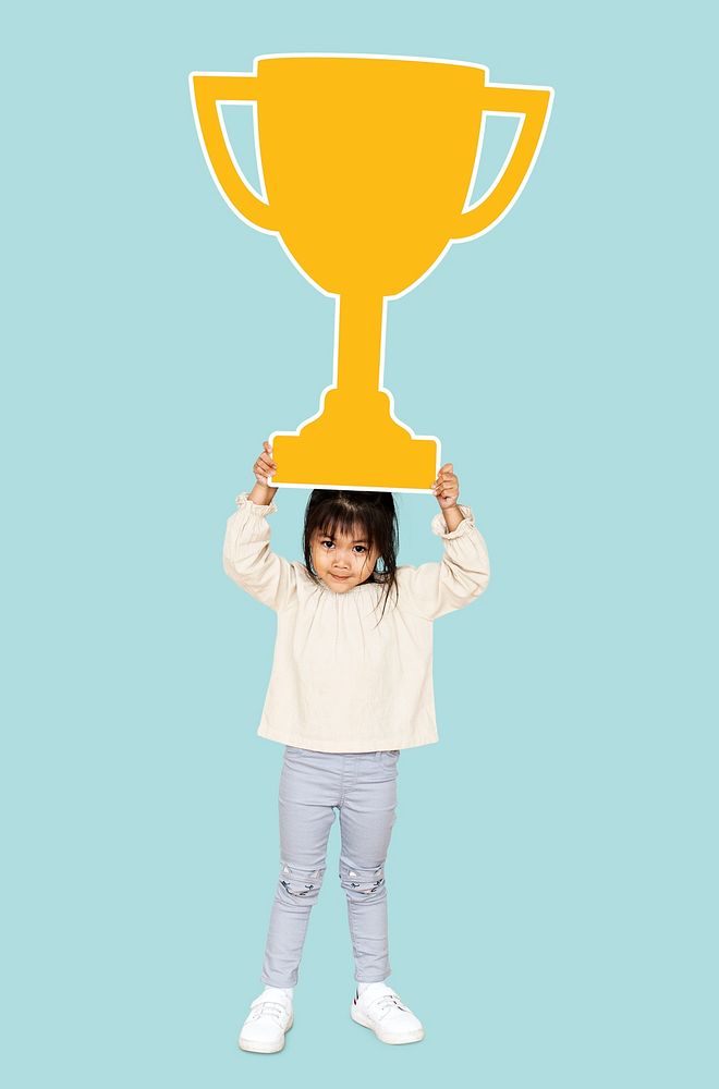 Girl celebrating success with a trophy