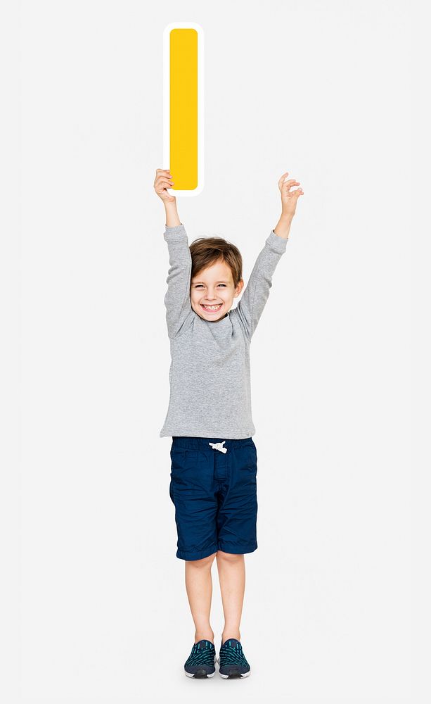 Happy boy holding the letter I