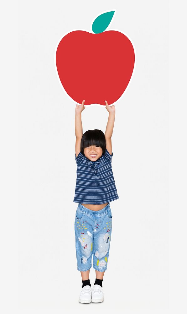 Cheerful kid with an apple