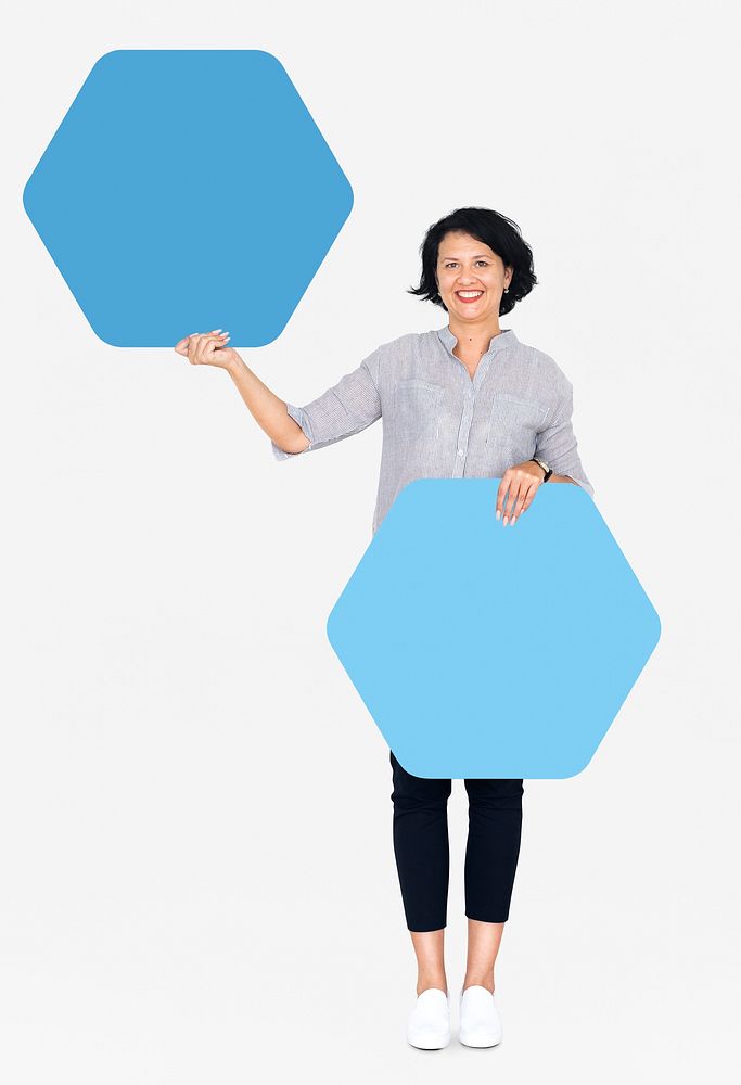 Cheerful woman showing blue hexagon shaped boards