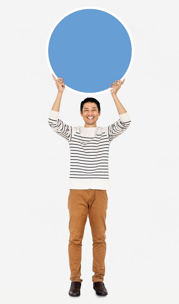 Cheerful man holding a blank blue circle