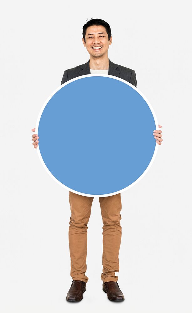 Businessman holding a blue round board