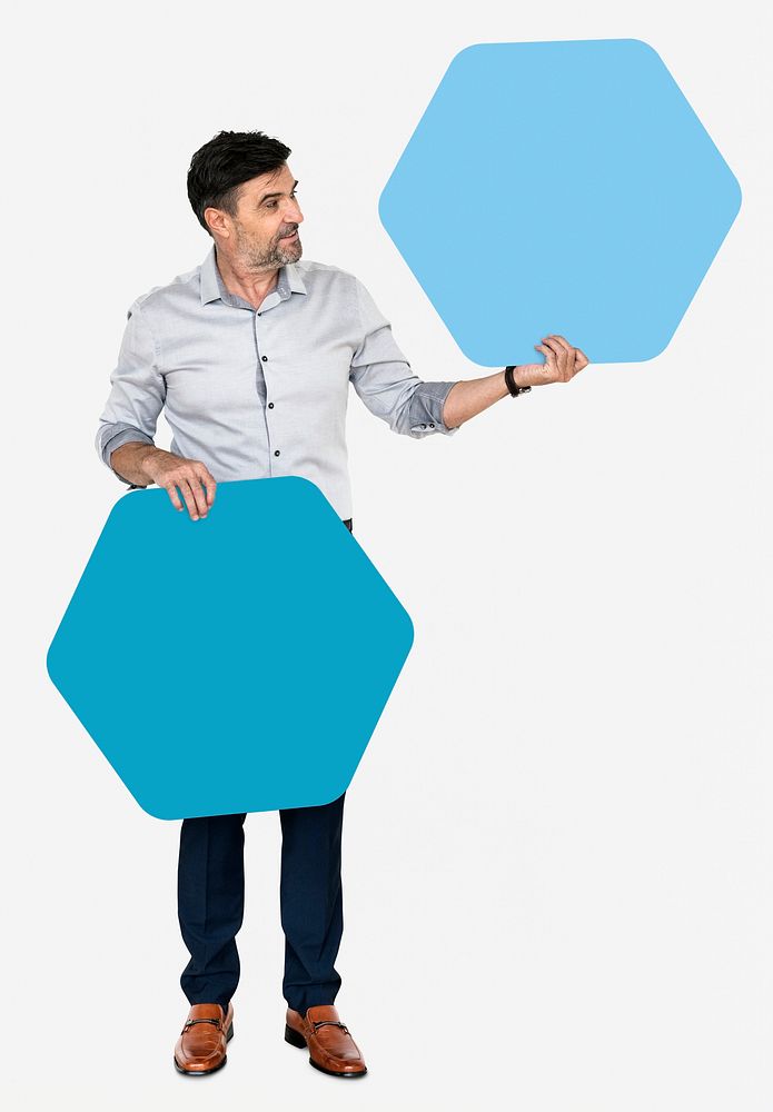 Cheerful man showing blue hexagon shaped boards