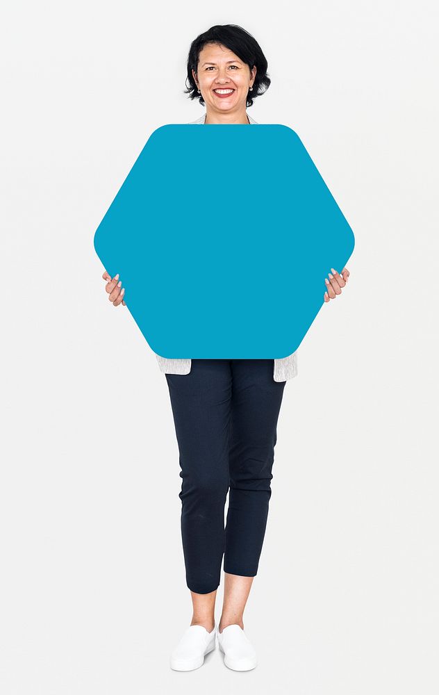 Cheerful woman showing a blank blue hexagon shaped board