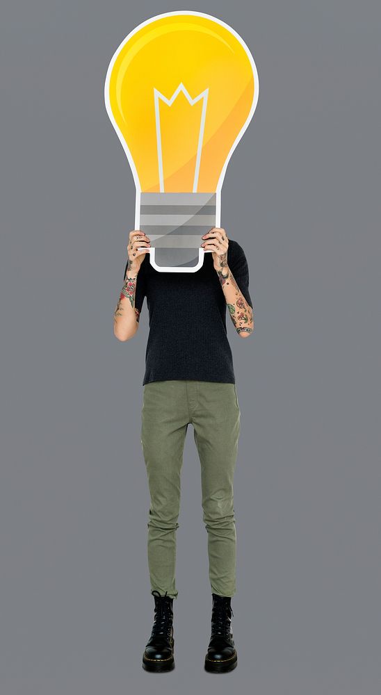 Woman holding a light bulb icon