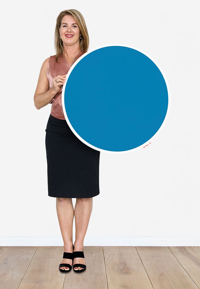 Happy woman showing blue round icon
