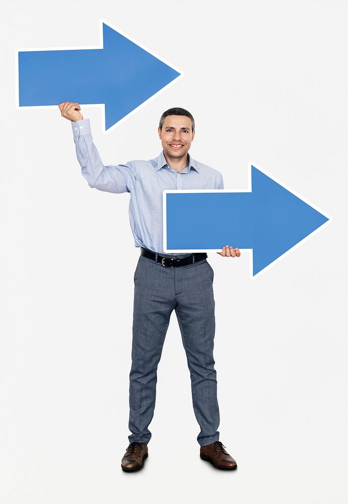 Businessman holding two blue arrows
