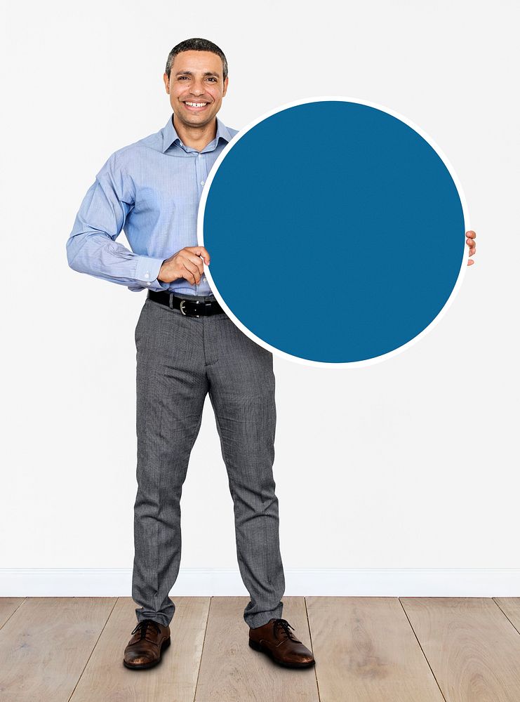 Businessman holding a blue circle
