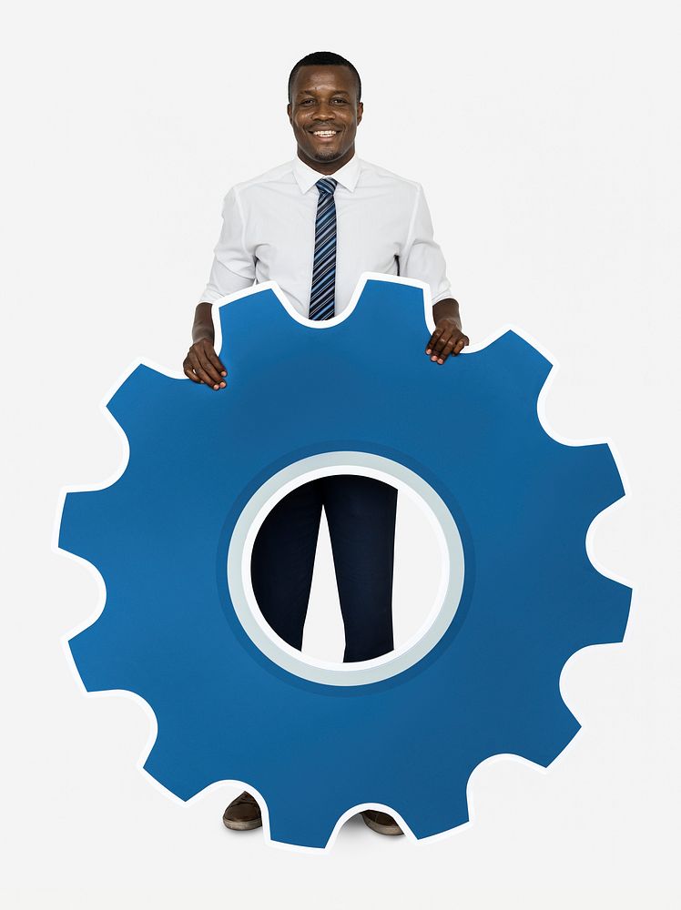 Businessman holding a cogwheel icon