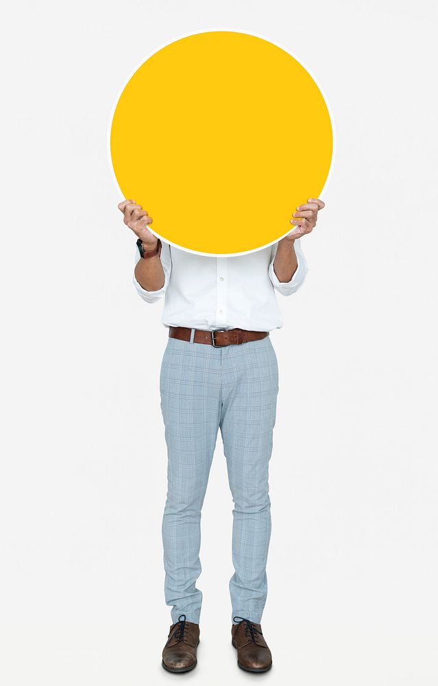 Man holding a round yellow board
