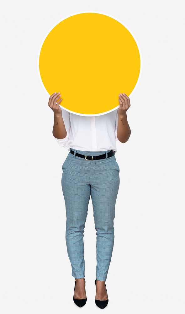 Woman covering her face with a yellow board