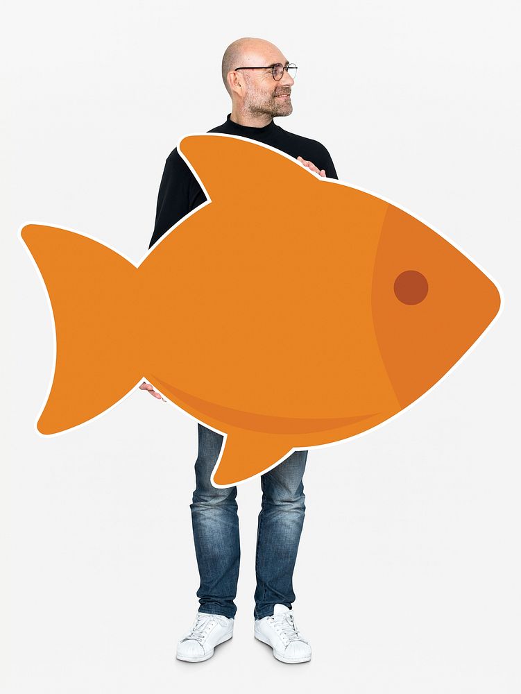 Happy man holding an orange fish