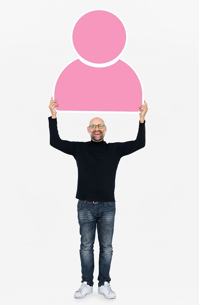 Cheerful man holding a pink user icon
