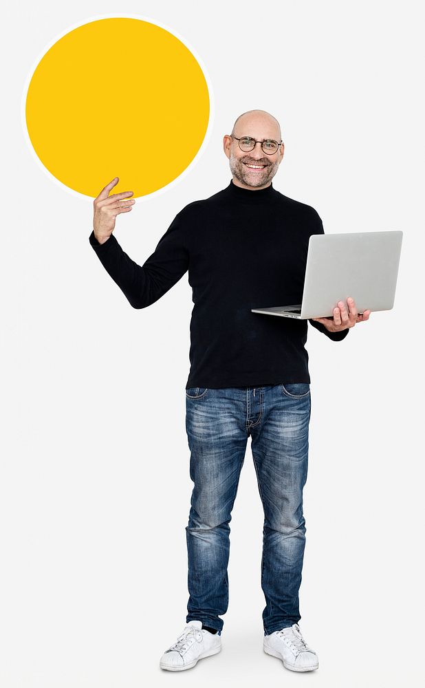 Happy man carrying a laptop and holding a round board