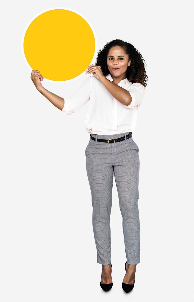 Cheerful woman holding a round yellow board