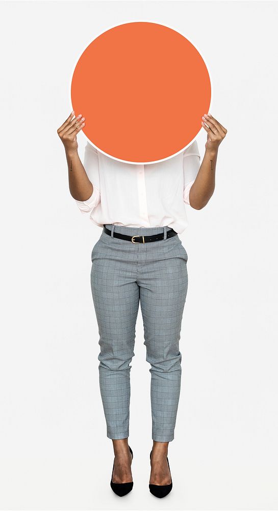Woman holding a round orange board
