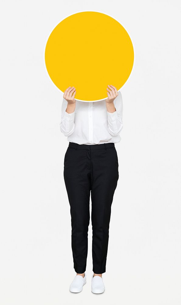 Woman holding a round yellow board