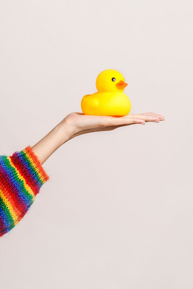 Cute rubber duck on a hand
