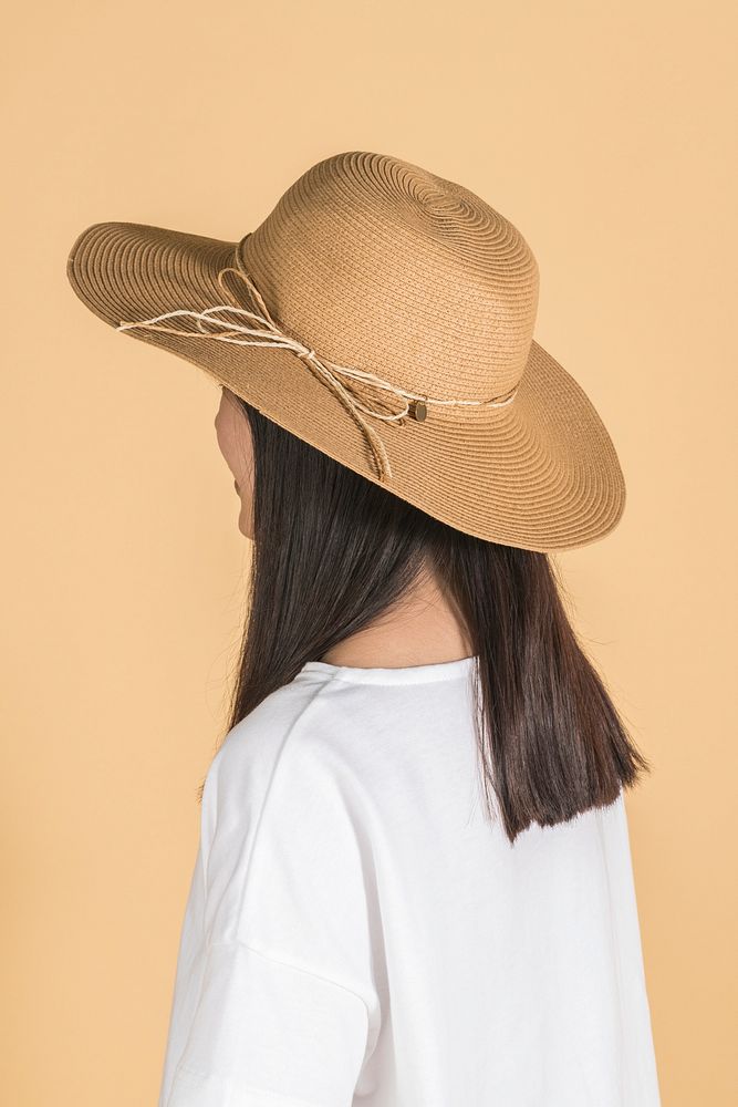 Woman wearing a wide brim beach hat profile portrait