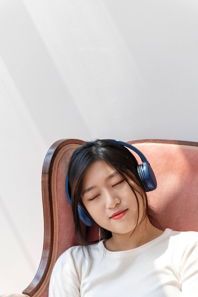 Asian woman fall asleep while listening to music