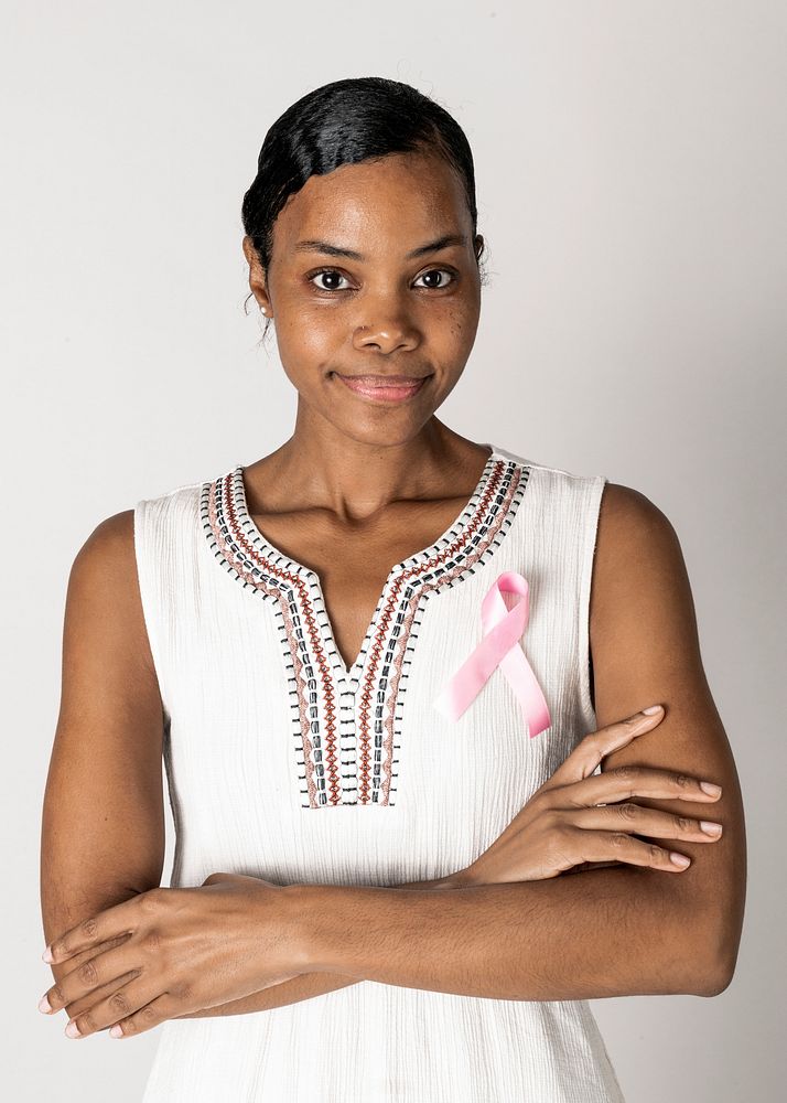 African American woman wearing a pink ribbon for brest cancer awareness