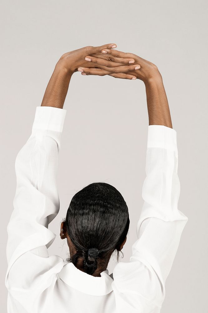 Black woman stretching her back muscles