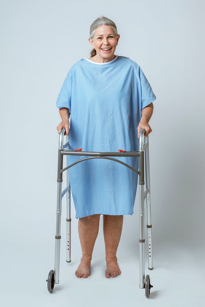 Happy senior patient using a zimmer frame 