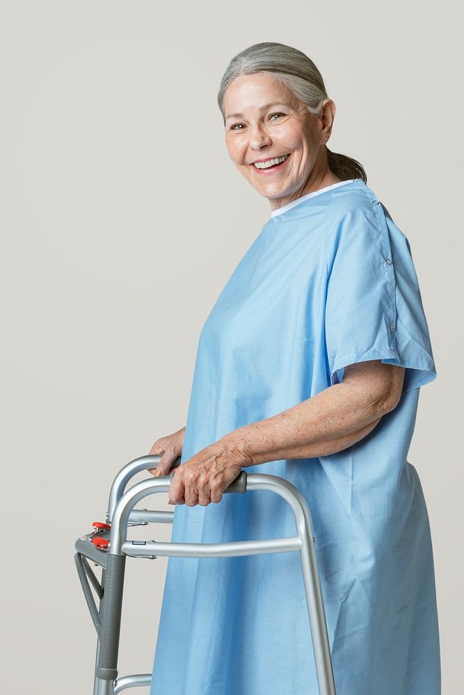 Happy patient in a hospital gown with a zimmer frame 