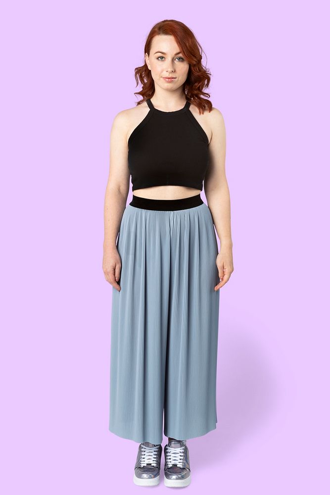 Woman wearing a crop top and skirt pants mockup 