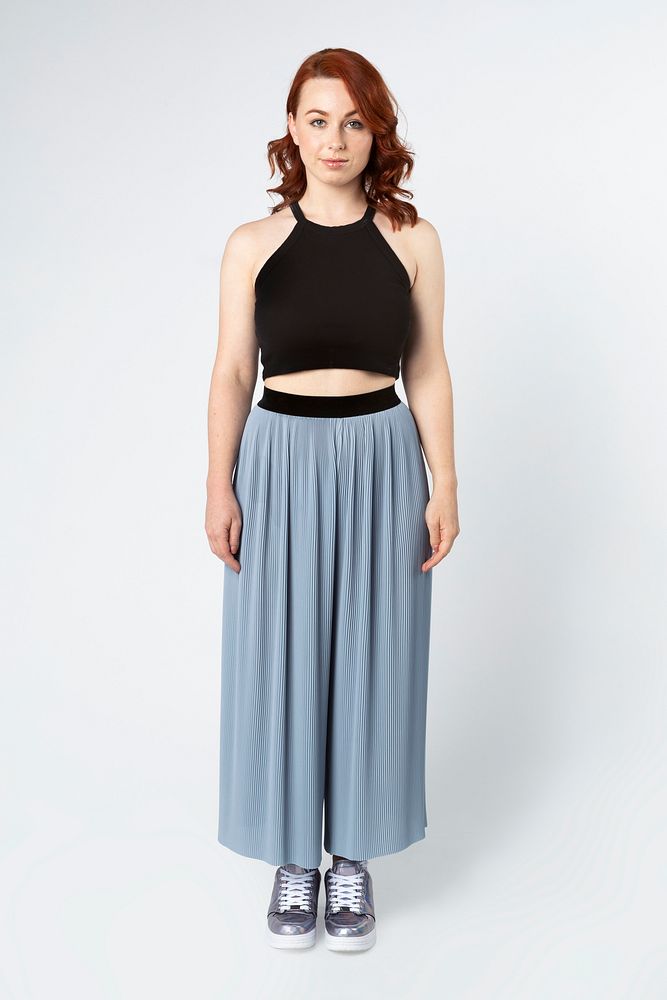 Woman wearing a crop top and skirt pants 